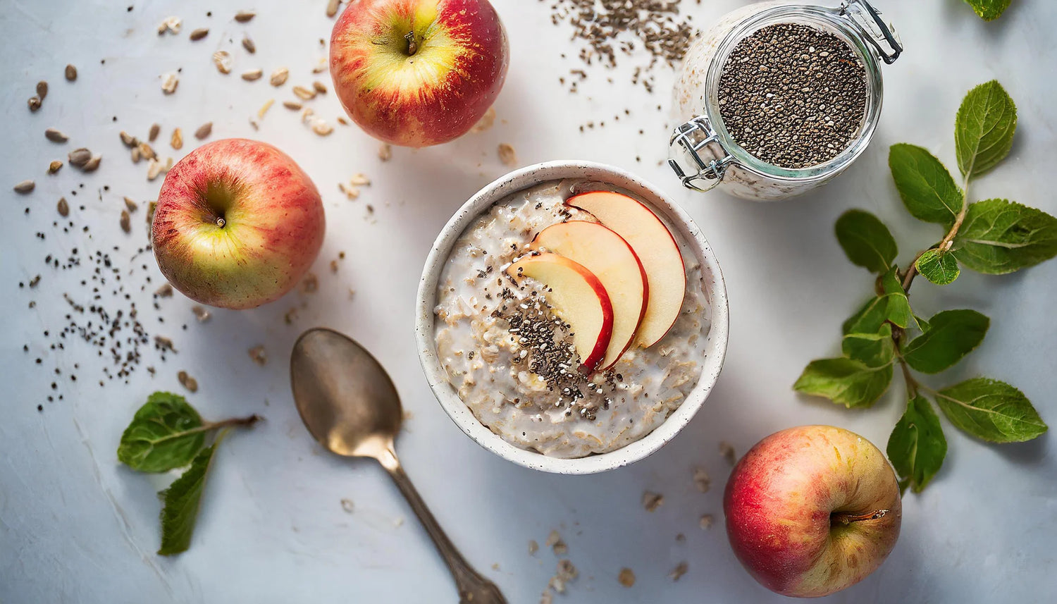 Overnight Oats with apples and chia seeds on a light background.