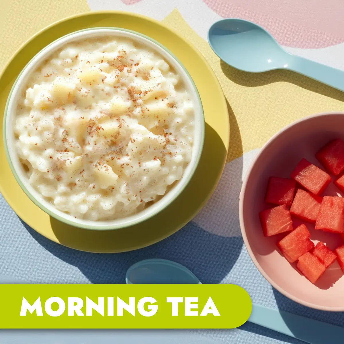 Bowl of rice pudding with a side of watermelon cubes on a colorful table setting, labeled 'Morning Tea'.