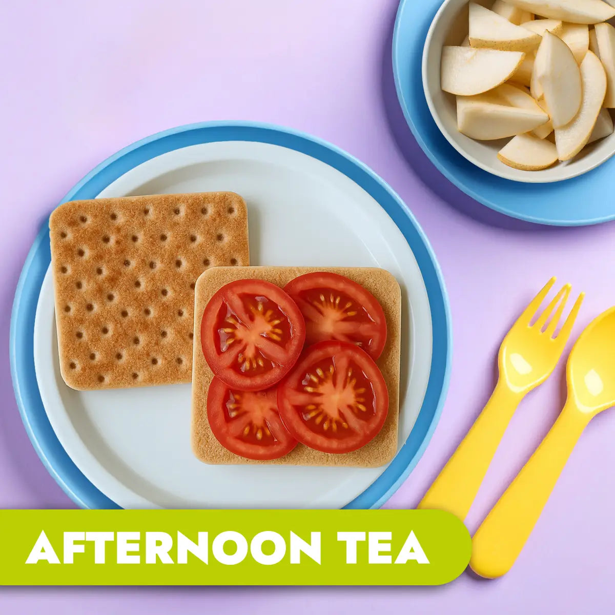 Afternoon tea setup with thins, tomatoes, and pears on a plate with utensils on a purple background.