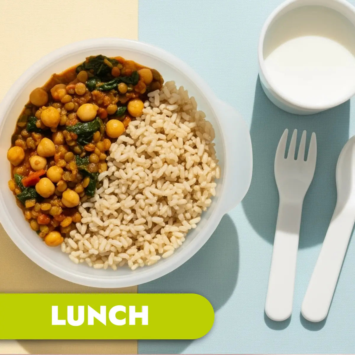 Lunch plate with chickpea curry and rice on a split blue and beige background