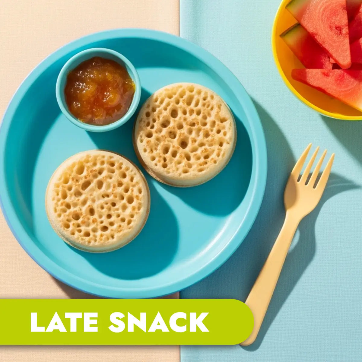TLG Childcare meals. Blue plate with crumpets, jam, and watermelon slices on a colorful background. Text 'LATE SNACK'
