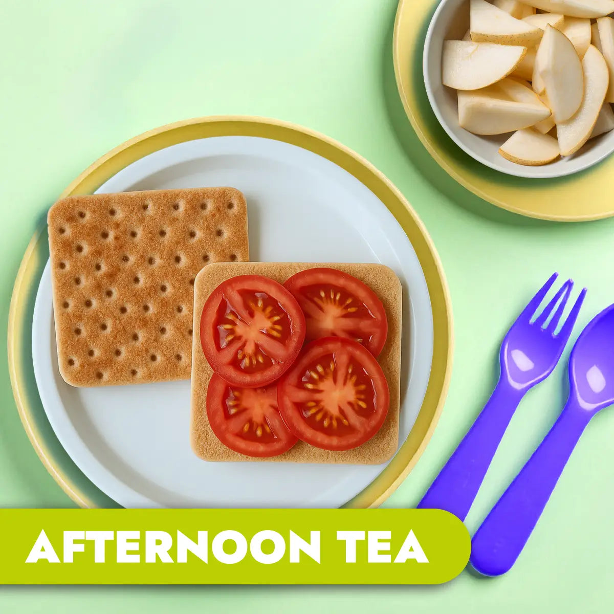 TLG Childcare catering Afternoon tea setup with wholemeal thins, tomatoes, and pear slices on a green background